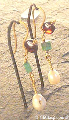 Earrings from Roman world I to III century AD,emerald, garnet and pearl 